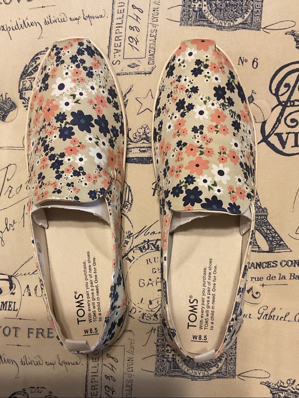TOMS Cream Floral Slip-On Moccasins with Navy and Peach Flowers